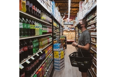 A person shops in a grocery store.